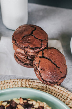 Chocolate brownie cookies. Baked Creamy Dark chocolate chip cookies on dark texture background....