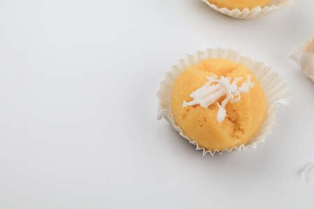 Toddy Palm Cake with coconut (Kanom Tarn) made from rice flour, palm oil, sugar and salt on white background, Thai dessert sweet taste delicious.の写真素材