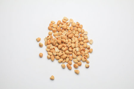 Roasted peanuts isolated on white background, clipping path, full depth of field. Selective focus