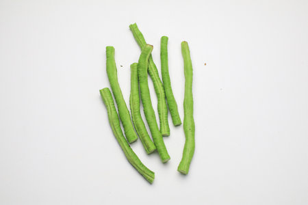 Chopped Cow pea beans on a white background. Vegetable, healthy, Thailand for sale in local marketの写真素材