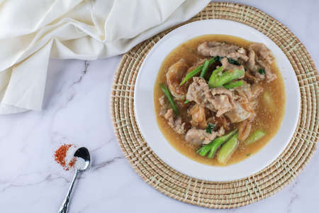 Fried noodle with pork and kale in gravy. Chinese and Thai Style food called "Thai food called Rad Na Moo"の写真素材