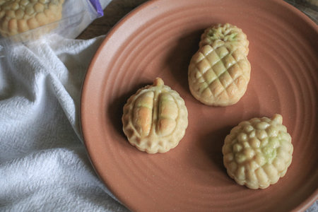 Taiwanese Pineapple Cakes, famous sweet delicious dessert food with tea, close up, copy space...