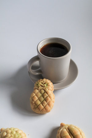 Pineapple cake is a sweet traditional Taiwanese pastry containing butte with a cup of coffee or tea,...
