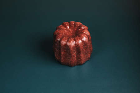 Caneles vanilla dark rum flavor traditional French sweet dessert with dark background. French Pastryの写真素材