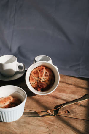Ham Cheese Croissant with Bacon on wooden board under morning sunlight, horizontal composition. Comfort food conceptの写真素材