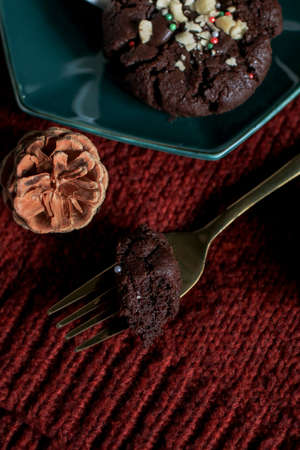 Chocolate Christmas Cookies with walnuts and chocolate chips on the table. Horizontal, biscuits festive background.の写真素材