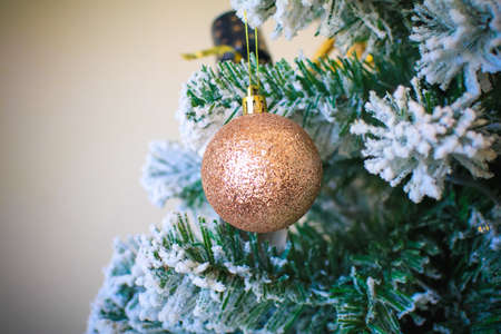 Decorated Christmas tree with bright balls and snow. Closeup of Festively Decorated. Happy New Year and Xmas theme.の写真素材