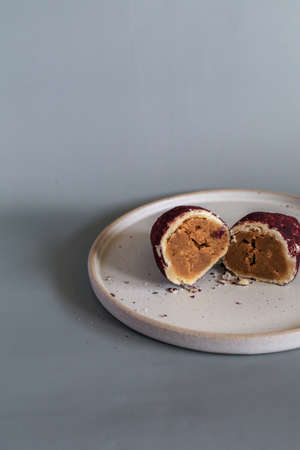 Baked sweet potato, made from mochi bread with Purple Sweet Potato inside. Food photography concept for backgroundの写真素材