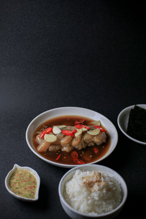 Pickled shrimps (Saewoo-Jang), marinate raw shrimps with chili, garlic and soy sauce on dark...
