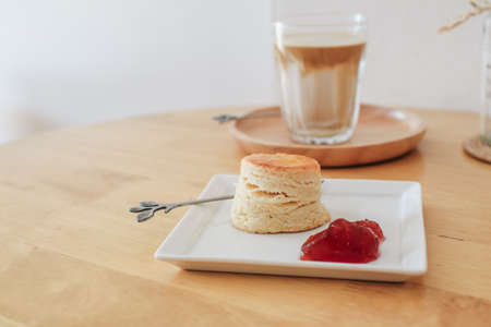 Scones with Strawberry Jam on white plate, Traditional English afternoon tea. copy space for text, selective focus.の写真素材