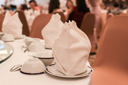 Napkin on Table set for an event party or wedding reception in a restaurant.の写真素材