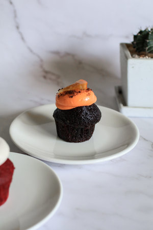 Delicious cupcakes red velvet and chocolate with a variety of frosting flavors. Birthday cake and...