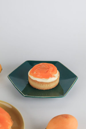 Mayongchid or marian plum cheese pie decorated with fresh plum mango. Homemade bakery concept with...