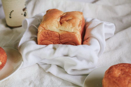 Homemade Fresh-baked homemade Hokkaido milk bread for Breakfast. Cooking at home. Selective focus....