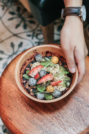 Acai smoothie bowls with strawberries, banana, blueberries, kiwi fruit and granola. Healthy Breakfast in summer.の写真素材