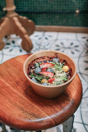 Acai smoothie bowls with strawberries, banana, blueberries, kiwi fruit and granola. Healthy Breakfast in summer.の写真素材