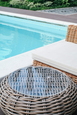 Round table and swimming pool on a tropical island. Concept of leisure and travel. Vacation time