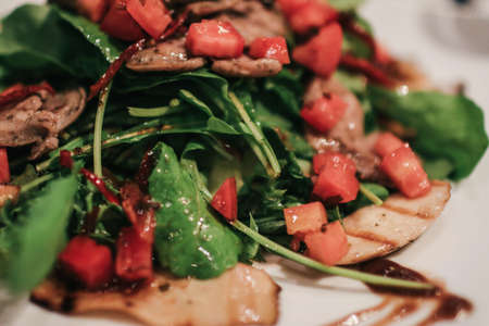 Vegetable salad with roasted chicken meat. Healthy and diet food concept. Italian salad concept.の写真素材