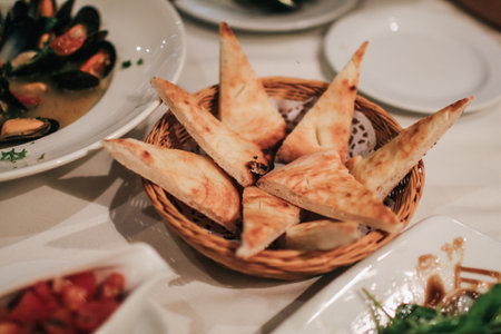 Bread eat with chopped fresh tomato, olive oil flavored with garlic for appetizer. Italian and French food. Dinner table concept.の写真素材