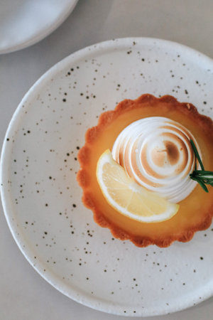 Lemon meringue tart pastry with citrus fruits. Delicious, appetizing, homemade dessert with lemon...