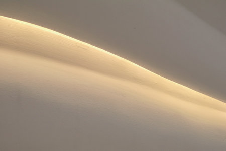 Light on abstract wavy white background. Smooth curves wave lines. Minimal White Geometric Wallpaper.の写真素材