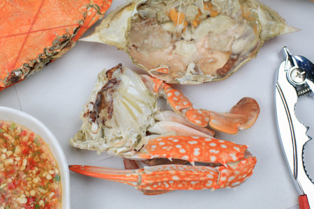 Steamed crab eating with spicy chili seafood dipping sauce. Thai style, seafood. Texture background with copy space for textの写真素材