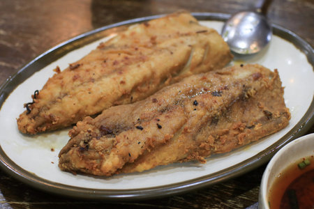 Grilled mackerel fish on table. Traditional Korean food. Lunch set.