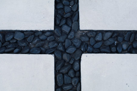 White concrete block floor with black stone in between with cross line in the middle, Abstract...