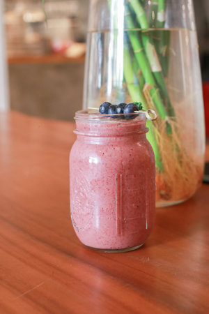 Mixed berry smoothie. Cocktail strawberry, raspberry, blueberry. Homemade antioxidant summer fruits. Well being and weight loss concept,の写真素材