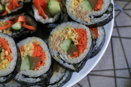 Gimbab roll made from steamed white rice and various other ingredients, rolled. Korean street food.