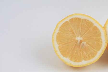 Lemon fruit on white background. Organic Natural summer tropical fruit. Minimal background with blank space to placed your design or packaging mockupsの写真素材