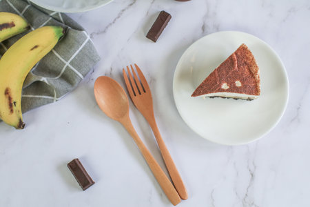 Homemade Banoffee cake made from bananas, whipped cream and a thick caramel sauce on table.の写真素材