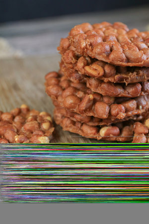 Thai Fried Peanut Cookies on dark background. Deep Fried Bean cookies peanut crackers made from nuts...