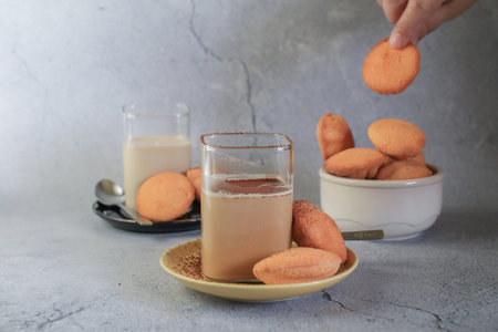 Ice coffee latte drink with Mini castella cake, Traditional Thai egg cake or Khanom Khai made with...