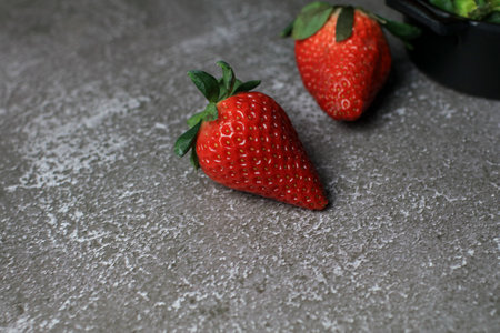 Fresh Strawberries on dark background. Summer red fruit with Copy space for text. Organic healthy eating.の写真素材