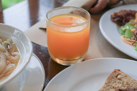 Fresh orange juice on wooden table. Traditional Organic healthy food and drink delicious morning meal.の写真素材