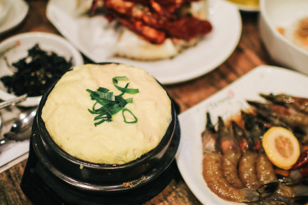 Korean Steamed Egg Custard with white smoke in hot clay pot. Gyeranjjim in korea. Atmosphere.