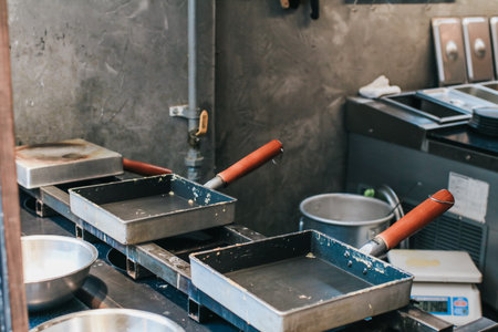 Square pan japanese style on stove in kitchen. Tamago traditional Rolled Omelet recipe.の写真素材