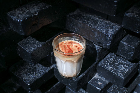 Iced coffee shake on gray cement floor. Refreshing drink with nature.の写真素材