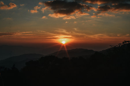 Sunrise over the mountains landscape with dramatic sky. Outdoor travel nature background wallpaper.の写真素材