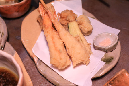 Deep fried vegetable and shrimp tempura with dipping cream sauce.の写真素材