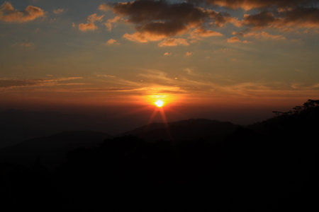 Landscape sunrise sky and cloud at morning on the mountain. Dramatic and majestic light. Beautiful scenic nature.の写真素材