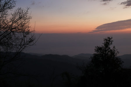 Landscape sky and cloud at morning on the mountain. Dramatic and majestic light. Beautiful scenic nature.の写真素材