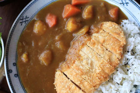 Fried pork cutlet curry with rice in beautiful plate. Popular Japanese food lunch set.の写真素材