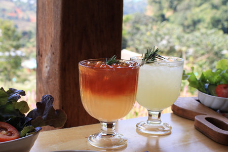 Iced americano black coffee with orange juice. Summer Tropical refreshing drink.の写真素材