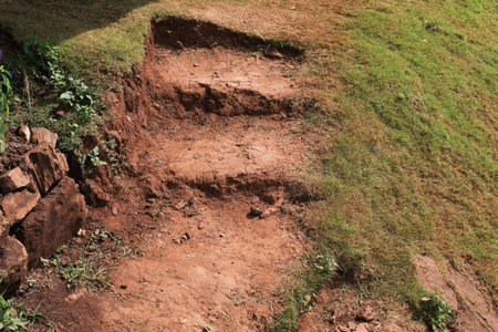 Natural clay stair architecture in tropical garden on mountain hill. Slippery outdoor floor background.の写真素材