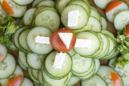 Light snack from cucumber with soft cheese adn tomatoesの写真素材