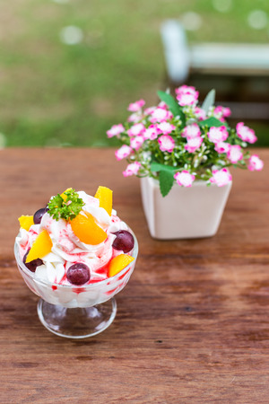Glass with blueberry-blackberr y, raspberry and strawberry with whipped sour cream. Shallow dofの写真素材
