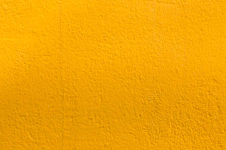 Yellow cement wall of new house.の写真素材