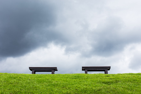 chair on a meadow with green grass and blue skyの写真素材